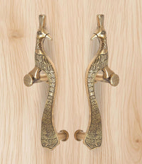 Brass peacock door handles pair with round knobs and detailed wing and tail pattern