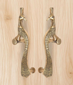 Brass peacock door handles pair with round knobs and detailed wing and tail pattern