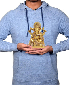 Brass Ganesha sculpture held in hands, seated four arms, ornate detailing, 7 inch