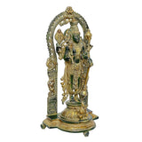 Side view of brass Vishnu statue with prabhavali arch and raised hands