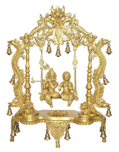 Golden brass Radha Krishna swing idol, seated on swing platform with bells