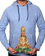Parvati bust statue in hands, brass with green robe and red accents