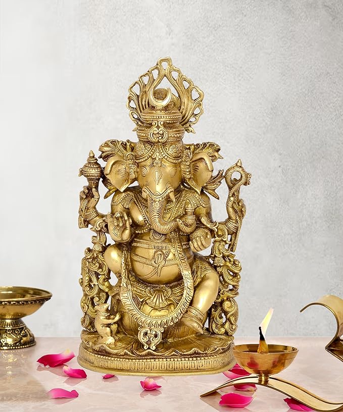 Gold Ganpati Ganesha idol statue, seated with ornate crown and multiple arms