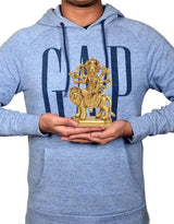 Durga Maa brass statue on pedestal held in hands with blue hoodie, 5 inch