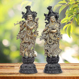 Brass Radha Krishna deity sculpture pair, standing on ornate dark pedestal