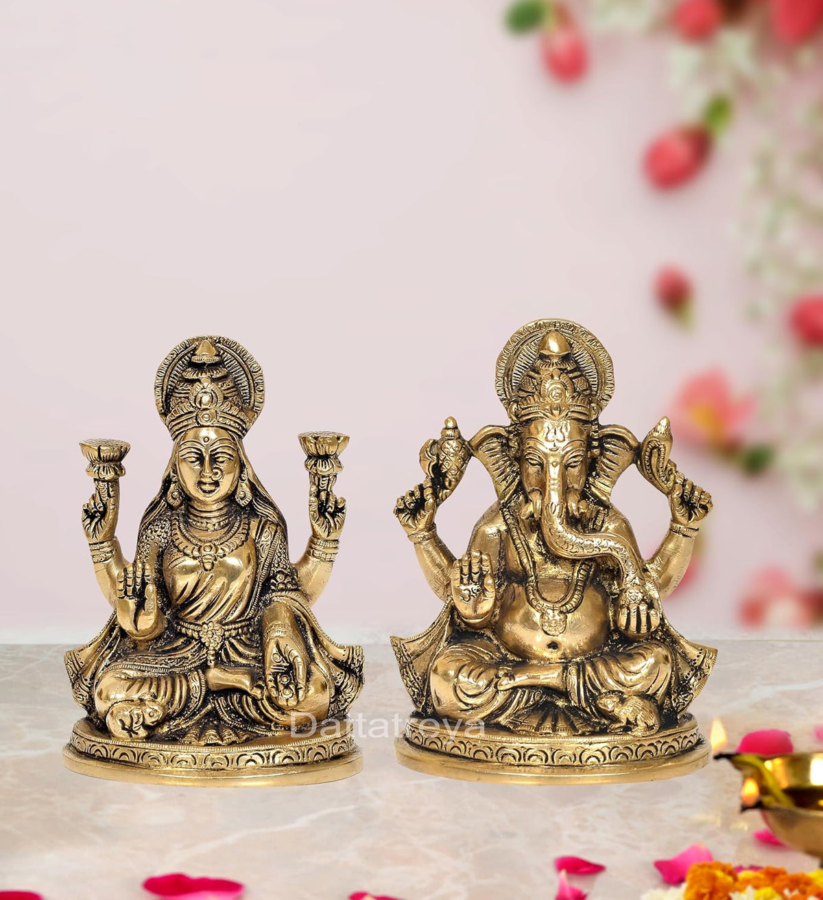 Brass Lakshmi and Ganesha idol set: Lakshmi seated with lamps, Ganesha seated with raised hands