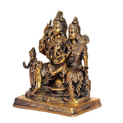 Brass Shiv Parivar statue from side view, seated deities with raised trident and accessories