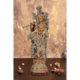 AONA brass Krishna figurine with ornate crown, holding flute, full-body standing on base