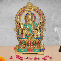 Lakshmi idol, gold-tone brass, seated with teal and red jeweled details