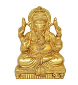 Brass Ganesha wall hanging idol close-up, detailed face and trunk, seated posture