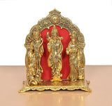 Ram Darbar statue front view: three gold-toned figures with red oval panel behind