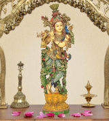 Lord Krishna resin sculpture playing flute, ornate multicolor detailing and golden crown