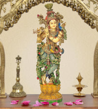 Lord Krishna resin sculpture playing flute, ornate multicolor detailing and golden crown