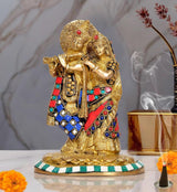 Brass Radha-Krishna statue with gold finish and jewel accents in red, blue, green
