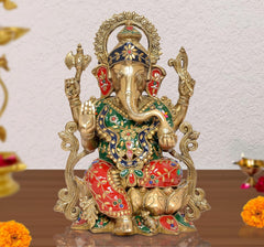 Brass Ganesha idol seated, colorful jeweled clothing, ornate halo—13 inch