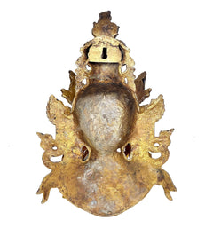 Back view brass Tara Devi mask wall hanging with embossed details and hanging loop