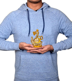 Brass Lord Ganesha idol held in hands, small temple pooja figurine