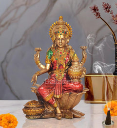 Lakshmi goddess resin statue, gold crown, green-red sari, seated on lotus with raised hands