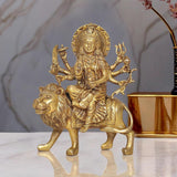 Brass Durga Maa idol seated on lion statue, multi-armed goddess figurine