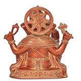 Brass Ganesh statue back view, round halo design and layered robe engravings