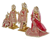 Brass Ram Darbar murti figures in red-and-gold outfits with gold crowns and eye-work