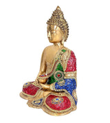Brass Buddha meditation idol with gold face and multicolor jeweled robe, seated cross-legged.