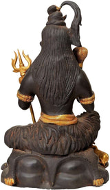 Seated Lord Shiva figurine from behind, long hair texture, trident and gold belt accents
