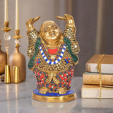 Brass laughing Buddha statue with raised hands, colorful jeweled robe, round base