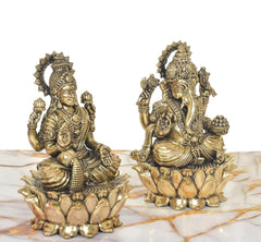 Three-quarter view brass Lakshmi and Ganesh statues, lotus petals and jeweled garments