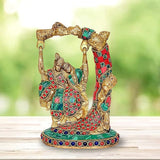 Radha Krishna Jhula statue: multicolor brass idol with swing frame, seated figures