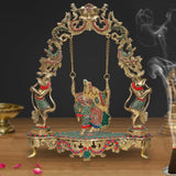Brass Radha Krishna swing statue, ornate gold arch and chain, 18-inch height