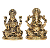 Brass Lakshmi and Ganesha statues, both seated with raised hands, detailed ornaments
