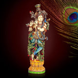 Krishna resin figurine, multicolored ornate outfit with crown and decorative pedestal base