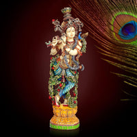 Krishna resin figurine, multicolored ornate outfit with crown and decorative pedestal base