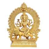 Golden brass Durga idol with eight arms seated on a lion, ornate arched back