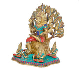 Dakshinamurti Shiva statue, ornate headdress and fan halo, seated on teal base