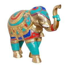 Brass elephant figurine side view, teal lower body with gold and red decorative accents