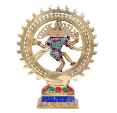 Brass Natraja statue from side, gold ring with cutouts, multicolor ornaments on blue base