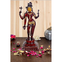 Brass Ardhanarishvara statue: red-and-gold figure with trident poses