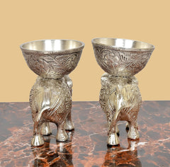 Silver elephant metal display bowls, rear view of pair showing ornate legs and empty cups