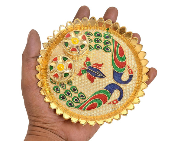 Handheld gold-plated pooja thali tilak plate with peacock design and two bowls