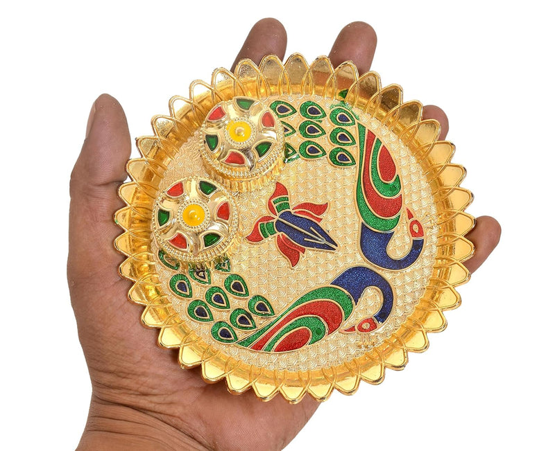 Handheld gold-plated pooja thali tilak plate with peacock design and two bowls