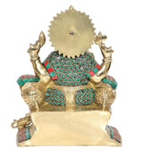 Back view of sitting Ganesha statue, gold-toned backplate with teal-green jeweled detailing