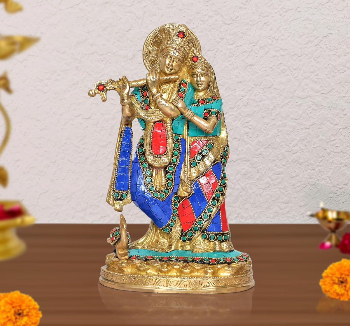 Brass Radha-Krishna idol statue with jeweled blue, red, and turquoise garments