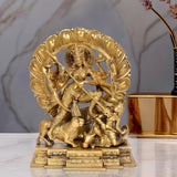 Brass Durga idol with ten arms, ornate halo and weapons, mounted on pedestal