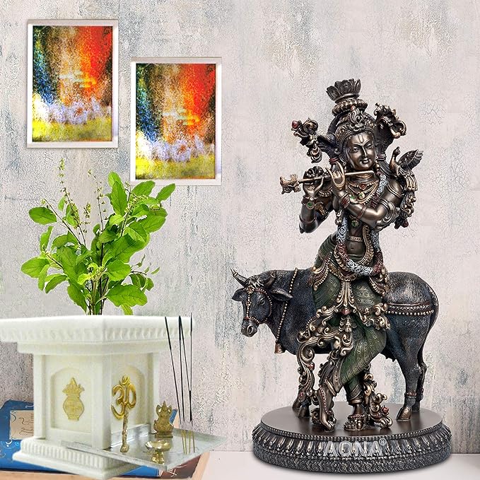 Resin Lord Krishna statue on dark cow, ornate metal finish, round pedestal
