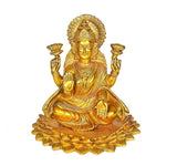 Brass Lakshmi idol statue with tall crown and four hands, seated on lotus base