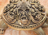 Bronze tortoise figurine closeup of engraved yantra panel with central symbol
