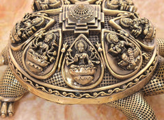 Bronze tortoise figurine closeup of engraved yantra panel with central symbol