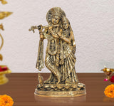 Brass Radha-Krishna idol statue with cow, detailed jewelry and ornate base